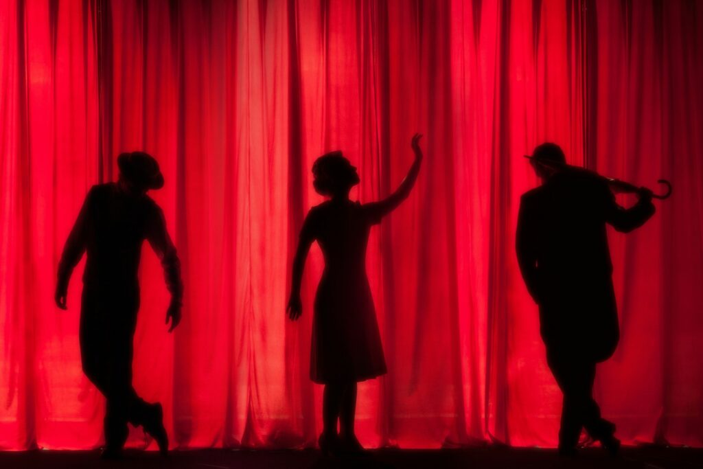A theatre stage illuminated for a performance